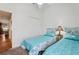 Bedroom featuring two beds, closet, and coastal themed decor at 703 Royal Palm Ave, Lady Lake, FL 32159