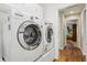 Bright laundry room featuring modern Samsung washer and LG dryer set at 703 Royal Palm Ave, Lady Lake, FL 32159