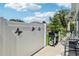 Fenced patio area with grill and garden view, ideal for outdoor entertaining at 703 Royal Palm Ave, Lady Lake, FL 32159
