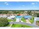 Aerial view of the home with blue roof and surrounding neighborhood at 714 Prado Dr, The Villages, FL 32159