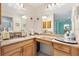 Bright bathroom with dual sinks, granite counters, and lots of storage at 714 Prado Dr, The Villages, FL 32159