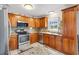 Beautiful kitchen featuring stainless steel appliances, granite countertops, and ample cabinet space at 714 Prado Dr, The Villages, FL 32159