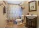 Cozy bathroom with shower, toilet and single sink vanity at 7211 Se 120Th St, Belleview, FL 34420