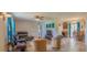 Inviting living room with tile floors and ample natural light, creating a comfortable and airy space at 7211 Se 120Th St, Belleview, FL 34420