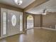 Inviting foyer with decorative front door, light wood floors, and a large window offering plenty of natural light at 728 Silversmith Cir, Lake Mary, FL 32746