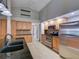Bright kitchen featuring stainless steel appliances, granite countertops, and wood cabinets at 728 Silversmith Cir, Lake Mary, FL 32746