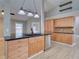 Kitchen island with granite countertops, stainless steel appliances, and tile backsplash at 728 Silversmith Cir, Lake Mary, FL 32746