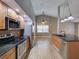 Well-lit kitchen with modern appliances and wood cabinets in an open floor plan at 728 Silversmith Cir, Lake Mary, FL 32746