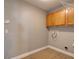 Practical laundry room with washer hookups and ample cabinet storage for an organized space at 728 Silversmith Cir, Lake Mary, FL 32746
