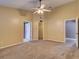 Spacious main bedroom with a ceiling fan, walk-in closet, and en-suite bathroom access at 728 Silversmith Cir, Lake Mary, FL 32746