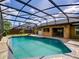 Beautiful screened-in pool with a brick-paved patio and an outdoor kitchen area for entertaining at 728 Silversmith Cir, Lake Mary, FL 32746
