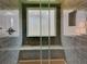 The large shower features dark tile, a granite bench, and a window for added light and ventilation at 728 Silversmith Cir, Lake Mary, FL 32746