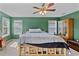 Brightly lit main bedroom featuring natural light and cozy decor, with unique wooden bed frame at 7901 Iceland Gull St, Winter Garden, FL 34787