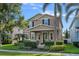 Inviting two-story home with a cozy front porch, beautiful landscaping, and a well-maintained lawn at 7901 Iceland Gull St, Winter Garden, FL 34787