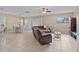 Bright, open concept living room and dining area with tile flooring and plenty of natural light at 7901 Iceland Gull St, Winter Garden, FL 34787