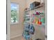 Walk-in pantry features extensive shelving and a window for natural light at 7901 Iceland Gull St, Winter Garden, FL 34787