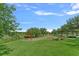 Neighborhood playground features green grass, a swing set, and other play structures at 7901 Iceland Gull St, Winter Garden, FL 34787