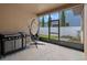 Enclosed lanai featuring patio furnishings, offering a cozy and relaxing outdoor living space at 7901 Iceland Gull St, Winter Garden, FL 34787