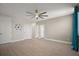 Spacious bedroom with modern flooring, ample natural light, and a stylish ceiling fan at 9153 Carmela Ave, Davenport, FL 33897