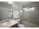 Standard bathroom featuring tile shower with glass door and a single sink vanity at 953 Mayo Ct, The Villages, FL 32162