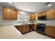 Bright kitchen featuring stainless steel appliances and an island counter with extra seating at 953 Mayo Ct, The Villages, FL 32162