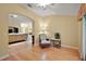 Inviting living area showcasing hardwood floors, archways, and natural light from the surrounding rooms at 953 Mayo Ct, The Villages, FL 32162