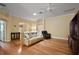 Spacious living room featuring hardwood floors, crown molding, and comfortable seating at 953 Mayo Ct, The Villages, FL 32162
