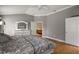 Comfortable main bedroom showcasing hardwood floors, a dresser, and an open doorway at 953 Mayo Ct, The Villages, FL 32162