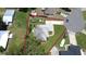 Aerial view highlighting property lines and the home's position, showcasing the lot and landscaping at 1007 Cr 463B, Lake Panasoffkee, FL 33538