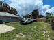 Expansive backyard featuring a truck and a boat at 1007 Cr 463B, Lake Panasoffkee, FL 33538
