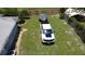Spacious backyard featuring a newer truck parked on a lush lawn, perfect for outdoor activities at 1007 Cr 463B, Lake Panasoffkee, FL 33538