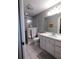 Bright bathroom with a shower and vanity offering counter space and storage at 1007 Cr 463B, Lake Panasoffkee, FL 33538