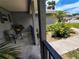 Relaxing front porch view with cozy seating area, lush greenery, and decorative gravel at 1007 Cr 463B, Lake Panasoffkee, FL 33538