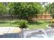 Hot tub with stone surround near lawn and privacy fence at 1007 Cr 463B, Lake Panasoffkee, FL 33538