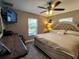 Spacious main bedroom with neutral walls, ceiling fan, and plenty of natural light at 1007 Cr 463B, Lake Panasoffkee, FL 33538