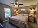 Spacious main bedroom with neutral walls, ceiling fan, and plenty of natural light at 1007 Cr 463B, Lake Panasoffkee, FL 33538
