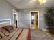 Main bedroom with hardwood floors and ceiling fan at 1007 Cr 463B, Lake Panasoffkee, FL 33538