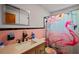 Charming bathroom with a flamingo-themed shower curtain and a coordinated vanity at 1048 Cr 452A, Lake Panasoffkee, FL 33538
