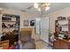 Bedroom featuring an upholstered chair, shelves and an organized closet at 1048 Cr 452A, Lake Panasoffkee, FL 33538