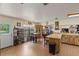 Eat-in kitchen and dining room with wood flooring and a large window for natural light at 1048 Cr 452A, Lake Panasoffkee, FL 33538