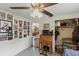 Hallway area with a desk, closet, and decorated walls featuring a ceiling fan with lights at 1048 Cr 452A, Lake Panasoffkee, FL 33538