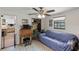 Living room featuring a blue sofa, desk and patterned floors at 1048 Cr 452A, Lake Panasoffkee, FL 33538