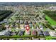 Aerial view of a residential neighborhood with a red pin marking a home at 10927 Se 168Th Loop, Summerfield, FL 34491