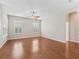 Spacious bedroom with hardwood floors, plantation shutters, and natural light at 10927 Se 168Th Loop, Summerfield, FL 34491