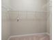 Empty walk-in closet has wire shelving for organization and storage at 10927 Se 168Th Loop, Summerfield, FL 34491
