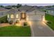 Well-maintained house with a spacious 2-car garage and neatly landscaped lawn at 10927 Se 168Th Loop, Summerfield, FL 34491
