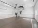 Clean, epoxy floored two-car garage with white walls at 10927 Se 168Th Loop, Summerfield, FL 34491