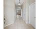 Neutral hallway with tile flooring, leading to a living area and bedrooms at 10927 Se 168Th Loop, Summerfield, FL 34491