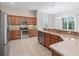 Modern kitchen features granite countertops, stainless steel appliances, and ample counter space at 10927 Se 168Th Loop, Summerfield, FL 34491