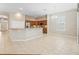 Bright kitchen with stainless steel appliances, granite countertops, and adjacent dining area at 10927 Se 168Th Loop, Summerfield, FL 34491